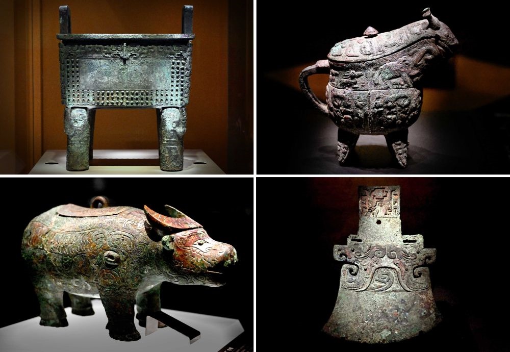 這是殷墟博物館新館內(nèi)展出的“司母辛”銅鼎（左上）、“亞長”銅觥（右上）、“亞長”牛尊（左下）、“亞長”銅鉞（拼版照片，2月23日攝）。
